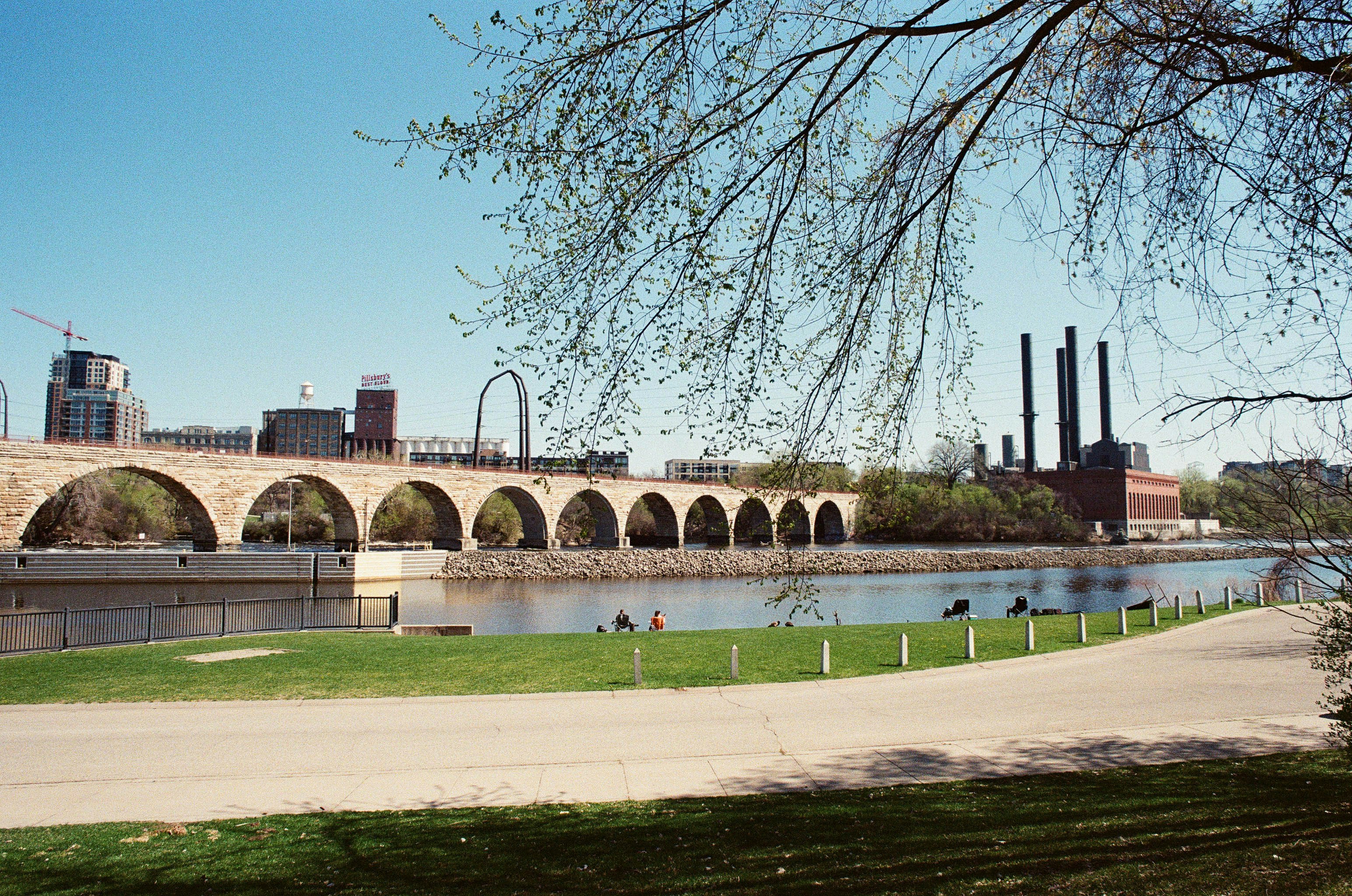 brown concrete bridge under blue sky during daytime